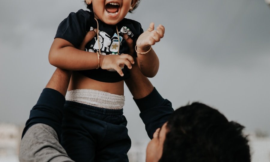 Relationships — Indian father joyfully lifting his child